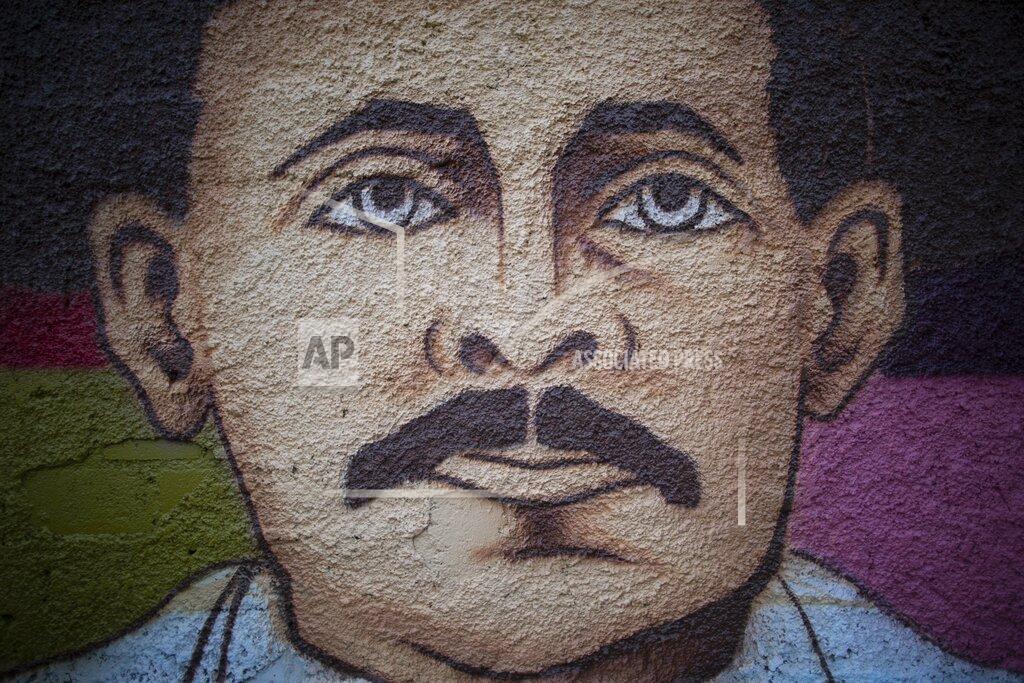 Ariana Cubillos A mural of Venezuelan popular saint, Dr. Jose Gregorio Hernandez by Venezuelan artist Miguel Garcia, stands in Caracas, Venezuela, Monday, April 26, 2021. Known as the doctor of the poor, Hernandez is set to be beatified by the Catholic church, a step towards sainthood, on April 30th. (AP Photo/Ariana Cubillos)