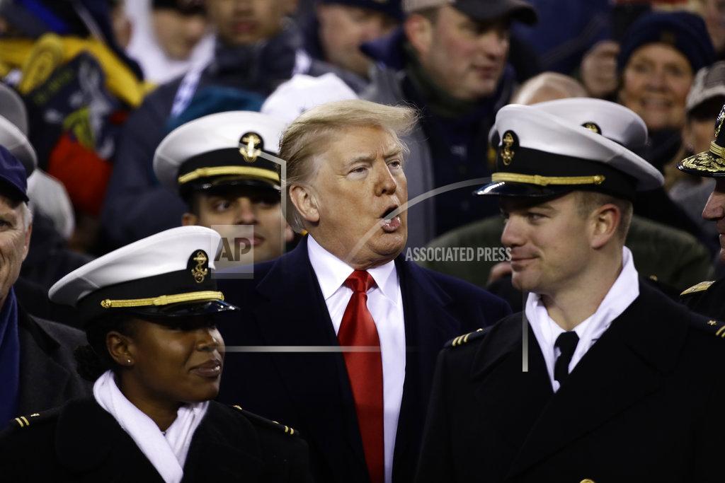 Matt Rourke President Donald Trump stands in the seating along the Navy sidelines before the second half of a NCAA college football game between Army and Navy, Saturday, Dec. 8, 2018, in Philadelphia. (AP Photo/Matt Rourke)