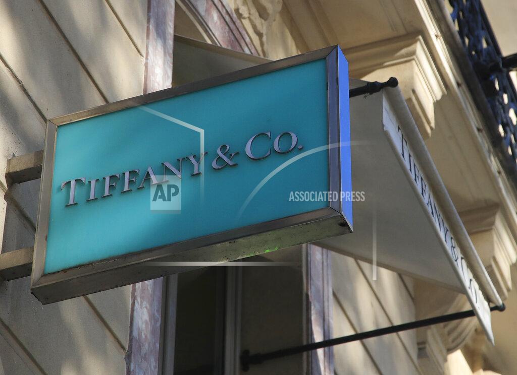 Michel Euler FILE - In this Nov. 25, 2019 file photo, the logo of Tiffany & Co. is pictured on the Champs Elysees avenue in Paris. Luxury goods giant LVMH is ending its takeover deal of the luxury jewelry retailer, citing in part the threat of proposed U.S. tariffs on French goods. (AP Photo/Michel Euler, File)
