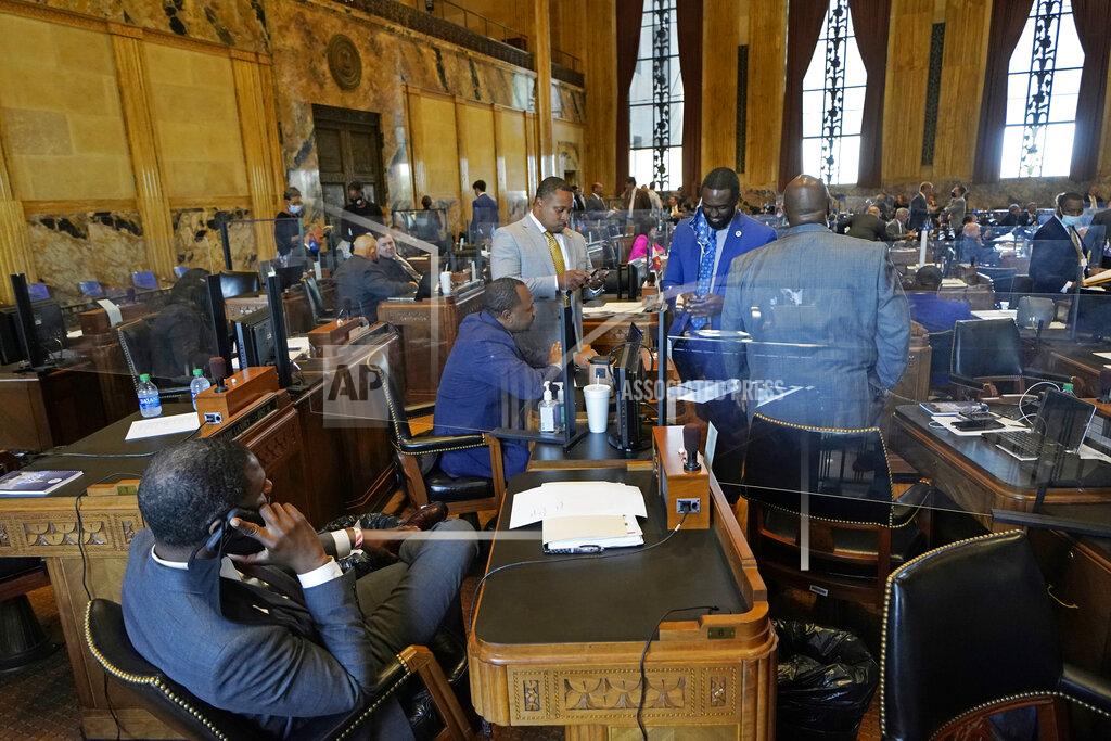 Gerald Herbert Ted James, D-Baton Rouge, second right, charmain of the Legislative Black Caucus in Baton Rouge, talks with fellow caucus members during opening day of the Louisiana legislative session in Baton Rouge, La., Monday, April 12, 2021. (AP Photo/Gerald Herbert)