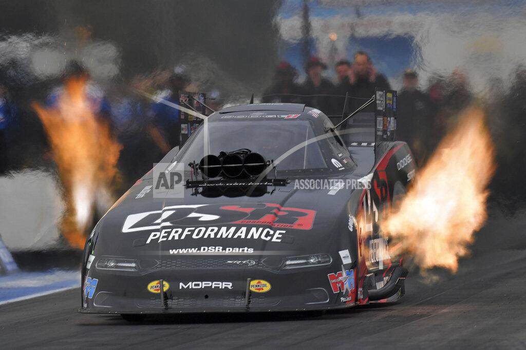 Uncredited In this photo provided by the NHRA, Matt Hagan drives in Funny Car qualifying Friday, June 11, 2021, at the TascaParts.com NHRA New England Nationals drag races in Epping, N.H. (Auto Imagery/NHRA via AP)