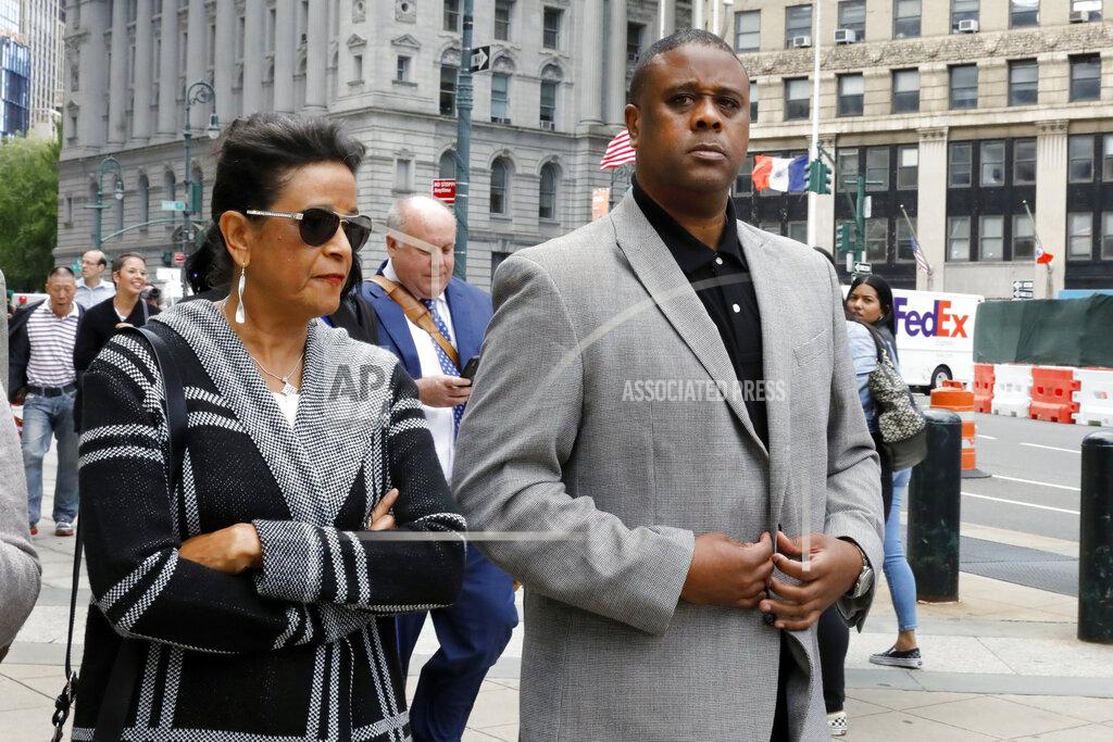 Richard Drew Former amateur basketball league director Merl Code, right, leaves federal court after sentencing, Friday, Oct. 4, 2019, in New York. Code was sentenced to three months in prison for his role in a college basketball bribery scheme that focused on NBA-bound athletes. (AP Photo/Richard Drew)