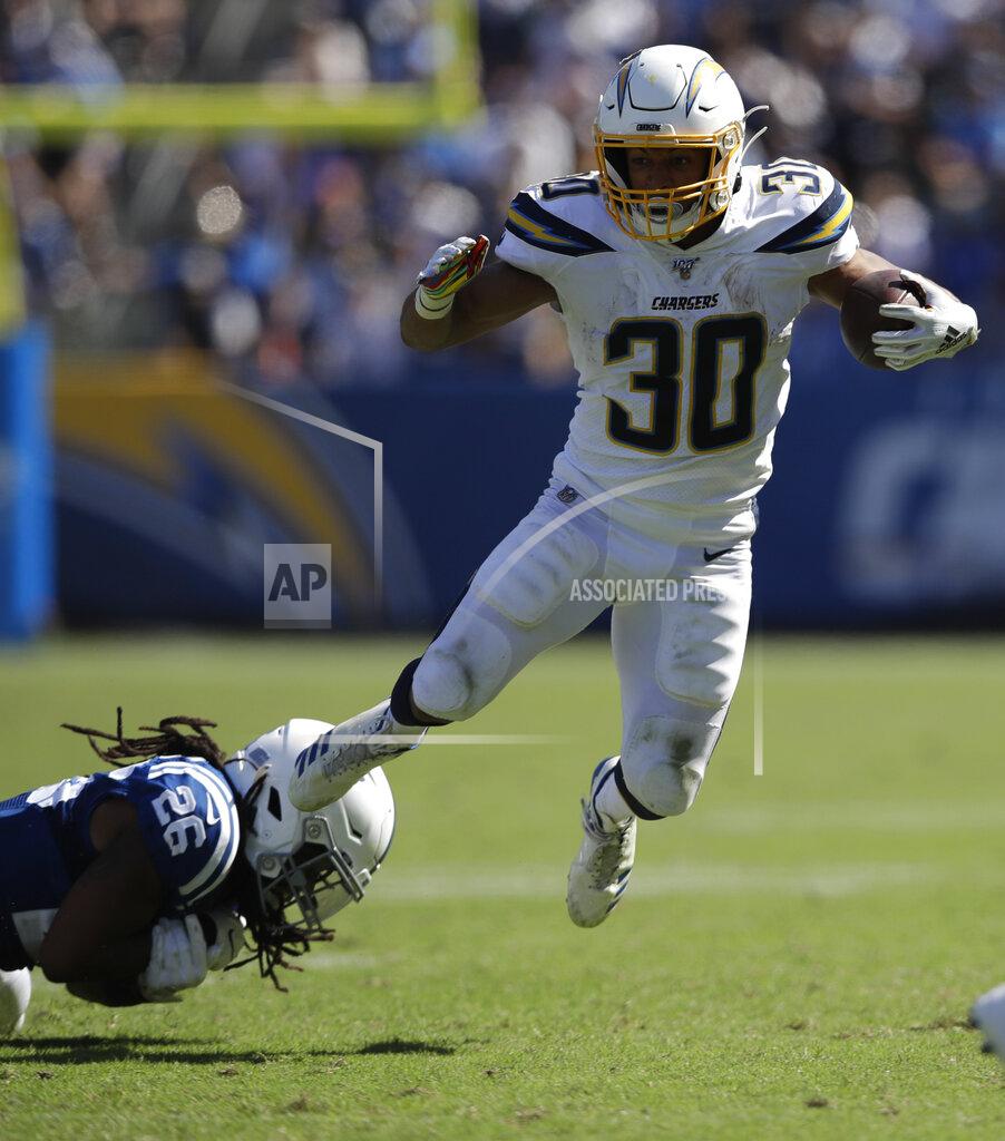Marcio Jose Sanchez Los Angeles Chargers running back Austin Ekeler, right, breast away form Indianapolis Colts strong safety Clayton Geathers during the second half in an NFL football game Sunday, Sept. 8, 2019, in Carson, Calif. (AP Photo/Marcio Jose Sanchez)
