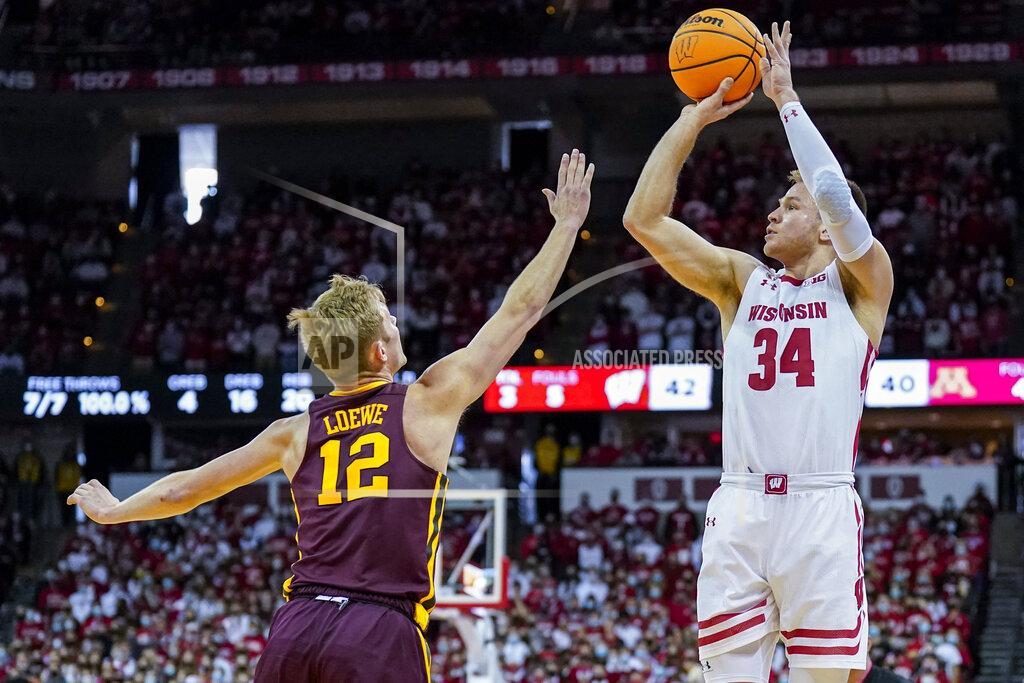 Andy Manis Wisconsin's Brad Davison (34) shoots against Minnesota's Luke Loewe (12) during the second half of an NCAA college basketball game Sunday, Jan. 30, 2022, in Madison, Wis. Wisconsin won 66-60. (AP Photo/Andy Manis)