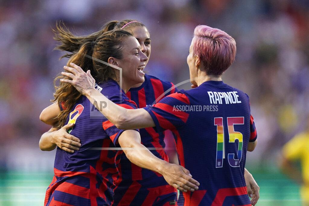 Rick Bowmer U.S. defender Sofia Huerta, left, forward Alex Morgan, rear, and forward Megan Rapinoe (15) celebrate after a first-half goal against the Columbia during an international friendly soccer match Tuesday, June 28, 2022, in Sandy, Utah. (AP Photo/Rick Bowmer)