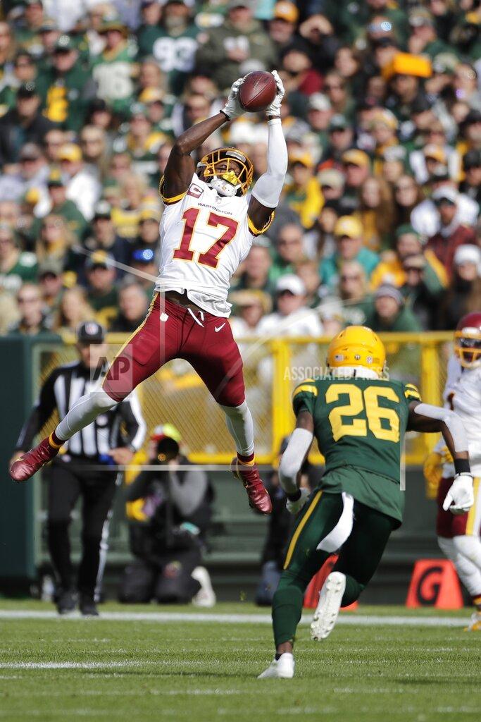 Aaron Gash Washington Football Team's Terry McLaurin catches a pass in front of Green Bay Packers' Darnell Savage during the first half of an NFL football game Sunday, Oct. 24, 2021, in Green Bay, Wis. (AP Photo/Aaron Gash)