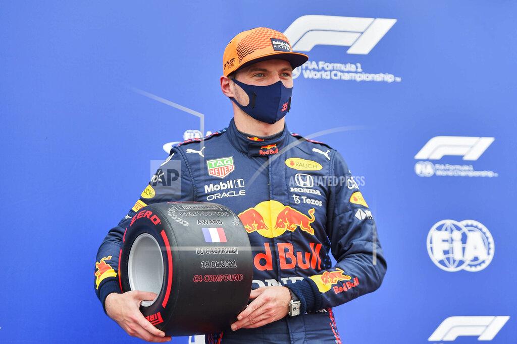 Nicolas Tucat Red Bull driver Max Verstappen of the Netherlands poses after he clocked the fastest time during the qualifying session ahead of the French Formula One Grand Prix at the Paul Ricard racetrack in Le Castellet, southern France, Saturday, June 19, 2021. The French Grand Prix will be held on Sunday. (Nicolas Tucat/Pool via AP)