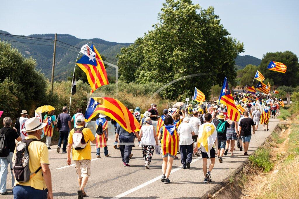 Marc Brugat Pro-independence Catalan demonstrators march towards Vimbodi, northeastern Spain, Monday, July 20, 2020 during a protest against the visit of Spain's King Felipe VI and Queen Letizia. The royal visit comes as a barrage of media leaks have revealed how the king's father, former monarch Juan Carlos I, allegedly hid millions of untaxed euros in offshore funds. (Marc Brugat/Europa Press via AP)