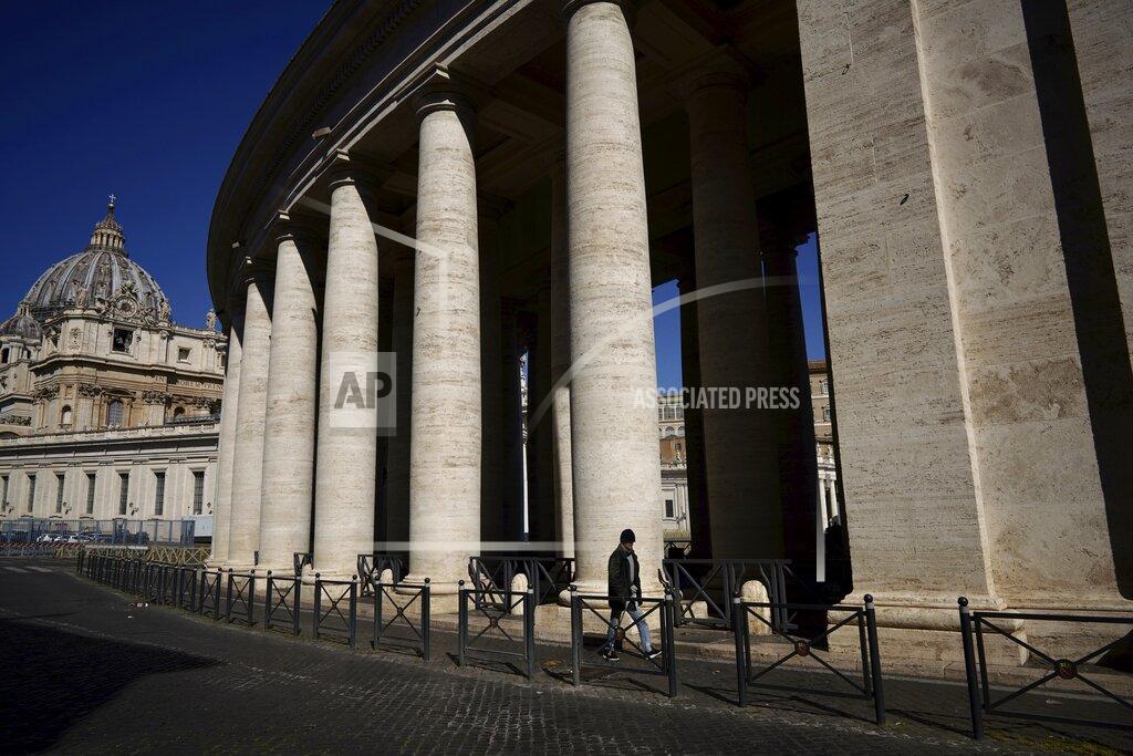 Andrew Medichini A man walks by Bernini's colonnade in St. Peter's Square during Pope Francis' weekly general audience, streamed by the Vatican television due to restrictions to contain the Covid-19 virus, at the Vatican, Wednesday, April 1, 2020. The new coronavirus causes mild or moderate symptoms for most people, but for some, especially older adults and people with existing health problems, it can cause more severe illness or death. (AP Photo/Andrew Medichini)
