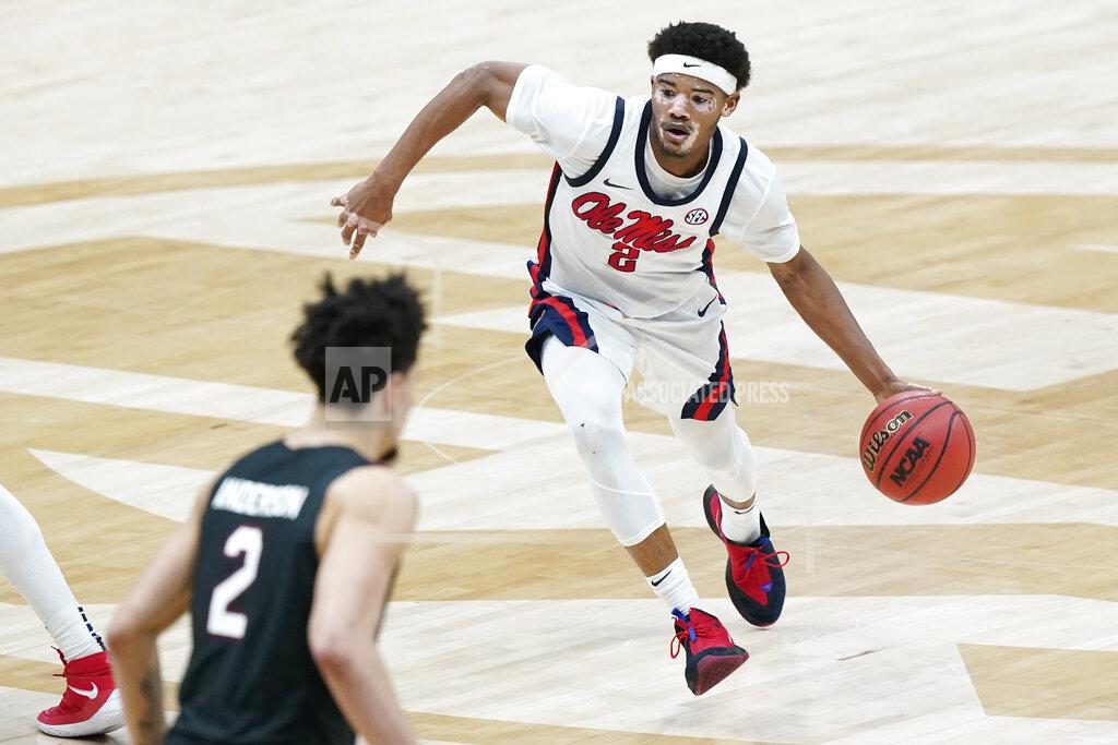 Mark Humphrey Mississippi's Devontae Shuler, right, moves the ball against South Carolina in the first half of an NCAA college basketball game in the Southeastern Conference Tournament Thursday, March 11, 2021, in Nashville, Tenn. (AP Photo/Mark Humphrey)