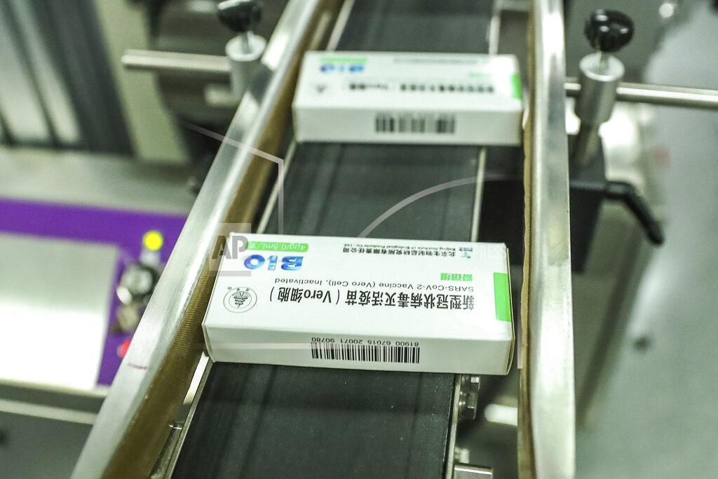 In this photo Dec. 25, 2020 released by Xinhua News Agency, packages of COVID-19 inactivated vaccine products are seen at a production plant of the Beijing Biological Products Institute Co., Ltd, a unit of state-owned Sinopharm in Beijing. The Chinese drugmaker said Wednesday, Dec. 30, 2020 its coronavirus vaccine was found to be 79.3% effective at preventing infection in preliminary data from the final round of testing, moving Beijing closer to possibly being able to fulfill its pledge to supply other developing countries.(Zhang Yuwei/Xinhua via AP)