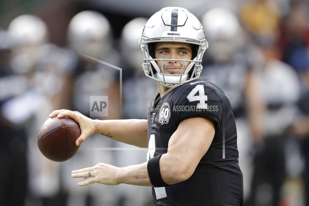 Ben Margot Oakland Raiders quarterback Derek Carr (4) passes against the Tennessee Titans during the first half of an NFL football game in Oakland, Calif., Sunday, Dec. 8, 2019. (AP Photo/Ben Margot)