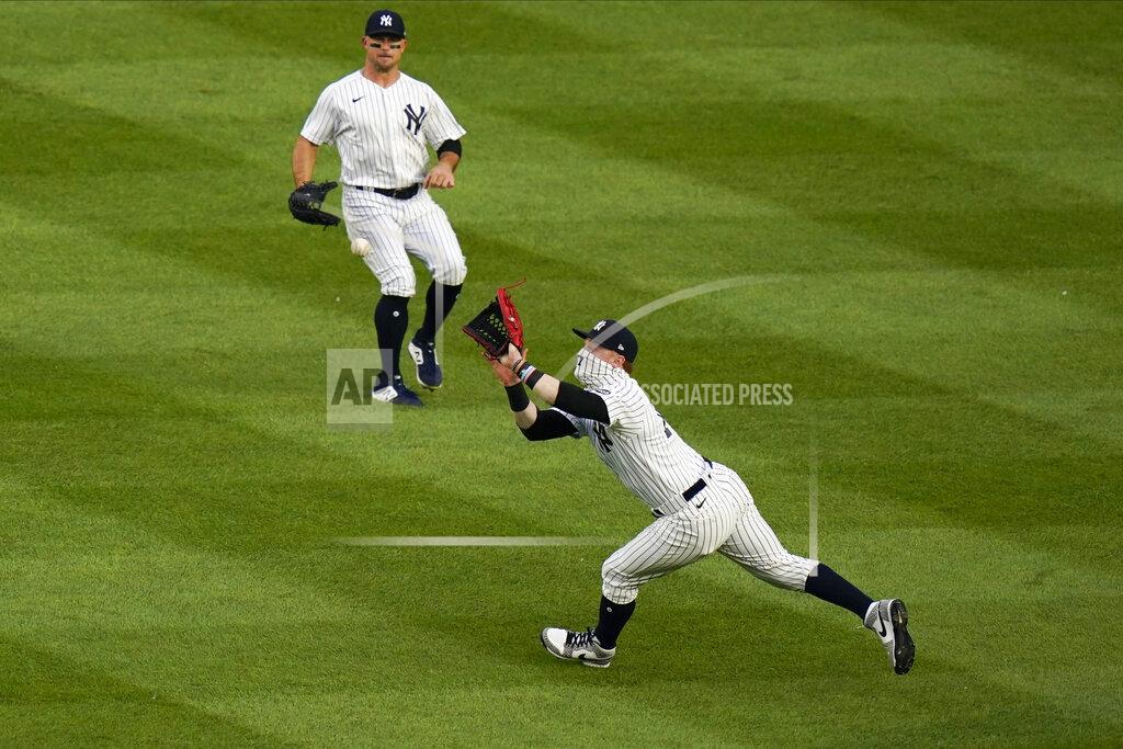 Frank Franklin Ii New York Yankees' Brett Gardner, center, watches as Clint Frazier catches a ball hit by Boston Red Sox's Xander Bogaerts for an out during the first inning of a baseball game Saturday, Aug. 15, 2020, in New York. (AP Photo/Frank Franklin II)