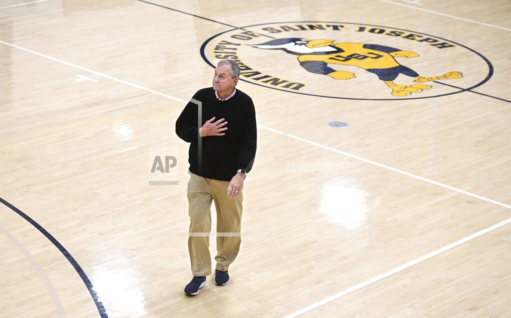 Jessica Hill Saint Joseph coach Jim Calhoun walks off the court to the locker room at the end of the first half of the team's NCAA college basketball game against Pratt Institute, Friday, Jan. 10, 2020, in West Hartford, Conn. Now coaching Division III basketball with the same fire he stalked the sidelines at UConn, Calhoun is reaching his 900th win as a college coach. (AP Photo/Jessica Hill)