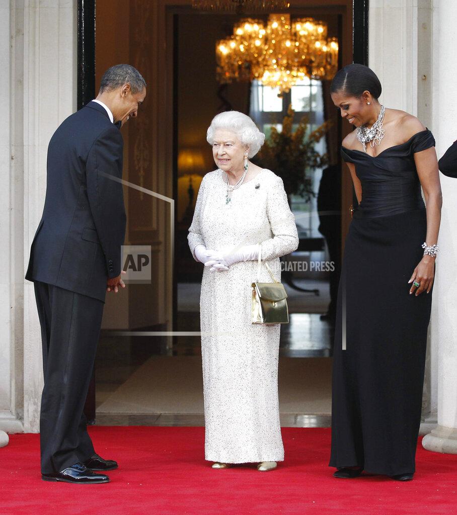 Charles Dharapak FILE - In this May 25, 2011 file photo, U.S. President Barack Obama and first lady Michelle Obama welcome Queen Elizabeth II for a reciprocal dinner at Winfield House in London. (AP Photo/Charles Dharapak, File)
