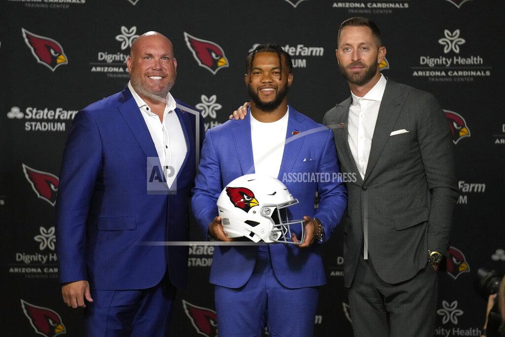 Rick Scuteri Arizona Cardinals general manager Steve Keim, left, quarterback Kyler Murray, center, and head coach Kliff Kingsbury pose during a news conference, Friday, July 22, 2022, in Tempe, Ariz. (AP Photo/Rick Scuteri)