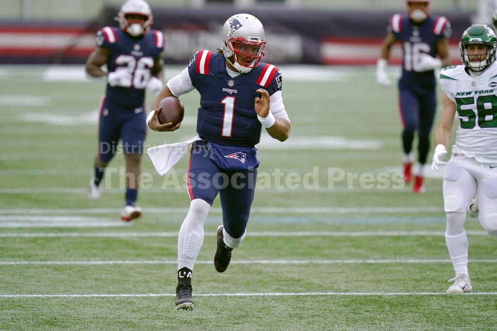 New England Patriots quarterback Cam Newton carries the ball against the New York Jets in the first half of an NFL football game, Sunday, Jan. 3, 2021, in Foxborough, Mass. (AP Photo/Elise Amendola)