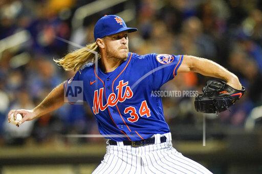 New York Mets' Noah Syndergaard pitches during the first inning in the second baseball game of a doubleheader against the Miami Marlins Tuesday, Sept. 28, 2021, in New York. (AP Photo/Frank Franklin II)