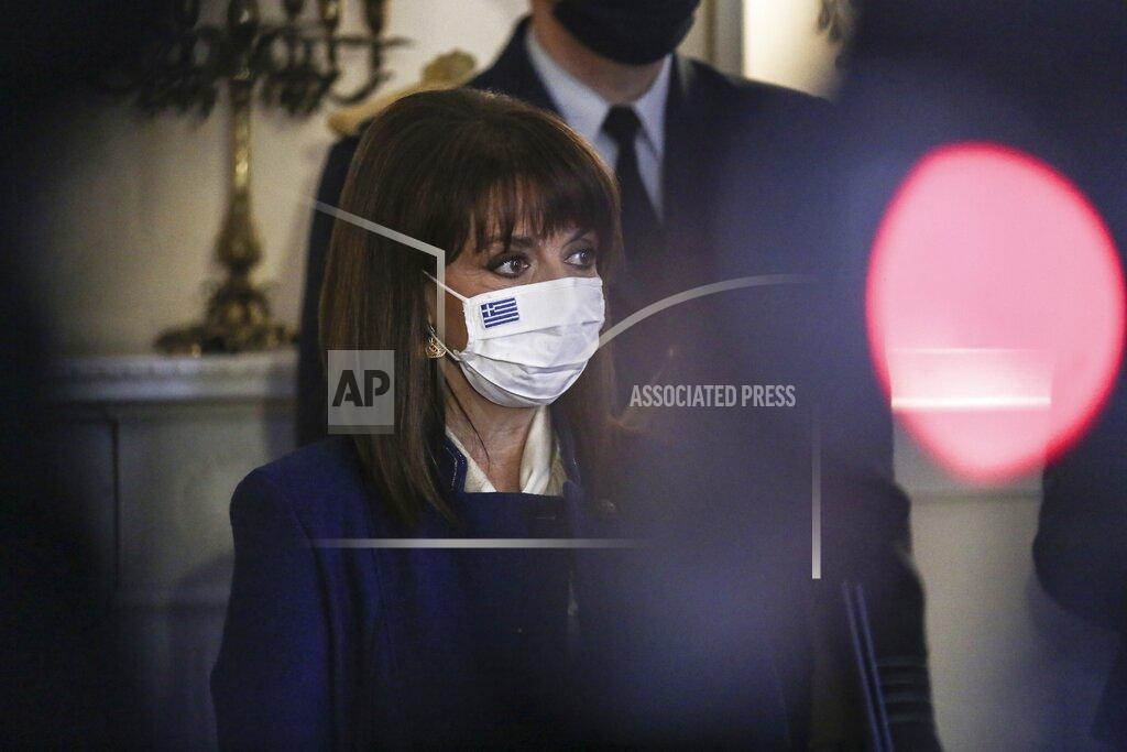 Theodore Manolopoulos In this photo provided by the Greek President's office, Greece's President Katerina Sakellaropoulou attends an award ceremony of Louvre Museum Director Jean-Luc Martinez at the Presidential Palace in Athens, Wednesday, March 24, 2021. The military parade on March 25, marking 200-years since the war that resulted in Greece's independence from the Ottoman Empire and rebirth as a nation, will be held without spectators due to the coronavirus, and only Greek and foreigners political officials. (Theodore Manolopoulos/Presidency of Hellenic Republic via AP)