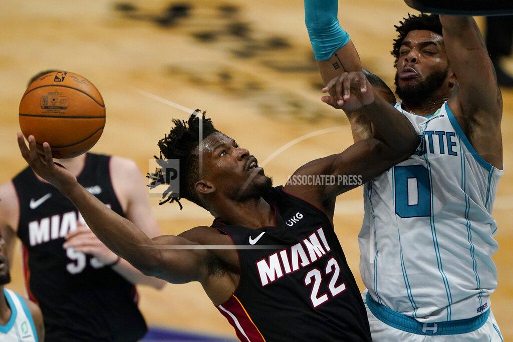 Chris Carlson Miami Heat forward Jimmy Butler shoots over Charlotte Hornets forward Miles Bridges during the first half of an NBA basketball game on Sunday, May 2, 2021, in Charlotte, N.C. (AP Photo/Chris Carlson)