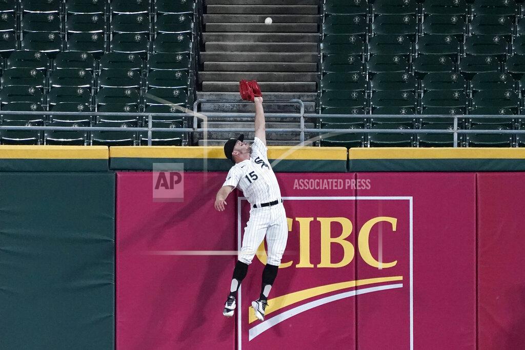Nam Y. Huh Chicago White Sox center fielder Adam Engel can't make the play on a ball hit for a three-run home run by Detroit Tigers' Jeimer Candelario during the fifth inning of a baseball game in Chicago, Wednesday, Aug. 19, 2020. (AP Photo/Nam Y. Huh)