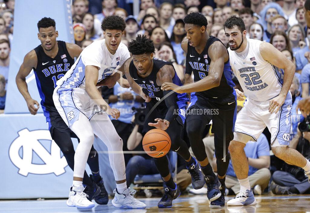 Gerry Broome North Carolina's Cameron Johnson and Luke Maye (32) chase the ball with Duke's Javin DeLaurier, left, Cam Reddish (2) and RJ Barrett during the second half of an NCAA college basketball game in Chapel Hill, N.C., Saturday, March 9, 2019. North Carolina won 79-70. (AP Photo/Gerry Broome)