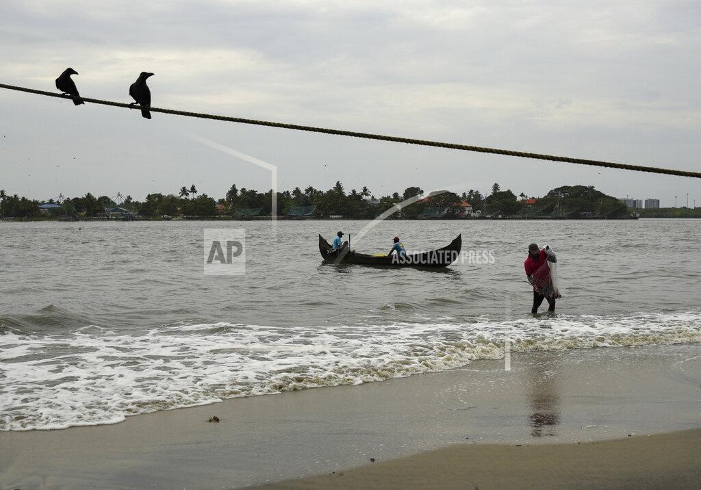 R S Iyer A fisherman brings in his catch from the Arabian Sea during the Coronavirus pandemic in Kochi, Kerala state, India, Friday, May 29, 2020. India’s economic growth will fall to 4.2% in financial year 2019-20 as compared to 6.1% in the previous year and likely to contract this year because of the coronavirus pandemic. Millions of workers have fled cities after losing their jobs as authorities imposed the lockdown in March and started easing it early this month to promote economic activity. (AP Photo/R S Iyer)
