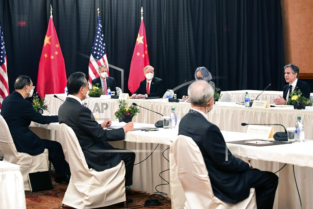 Frederic J. Brown Secretary of State Antony Blinken, far right, speaks as Chinese Communist Party foreign affairs chief Yang Jiechi, left, and China's State Councilor Wang Yi, second from left, listen at the opening session of US-China talks at the Captain Cook Hotel in Anchorage, Alaska, Thursday, March 18, 2021. (Frederic J. Brown/Pool via AP)