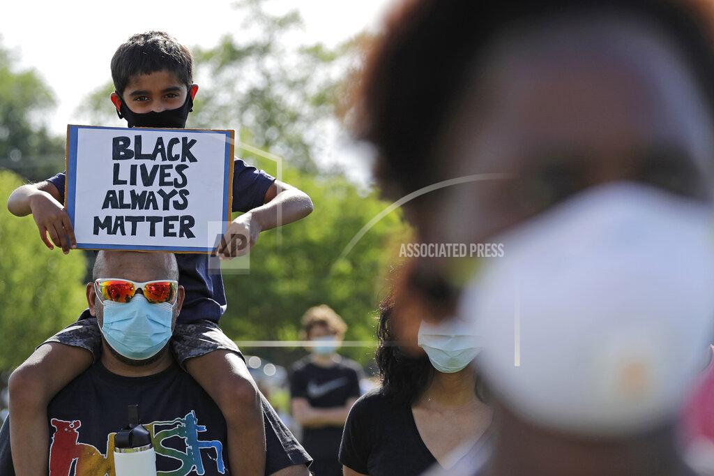 Nam Y. Huh Demonstrators gather to protest for George Floyd during a Black Lives Matter protest at the Buffalo Grove park District's Spray 'N Play in Buffalo Grove, Ill., Thursday, June 4, 2020. Floyd, a black man, died after he was restrained in custody by the Minneapolis police on May 25. (AP Photo/Nam Y. Huh)