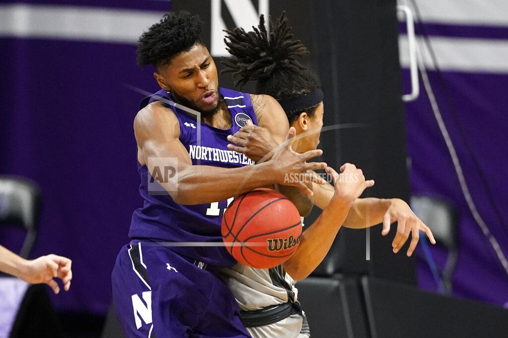 Nam Y. Huh Northwestern guard Anthony Gaines, left, battles for a rebound against Chicago State forward Jordan Polynice during the first half of an NCAA college basketball game in Evanston, Ill., Saturday, Dec. 5, 2020. (AP Photo/Nam Y. Huh)