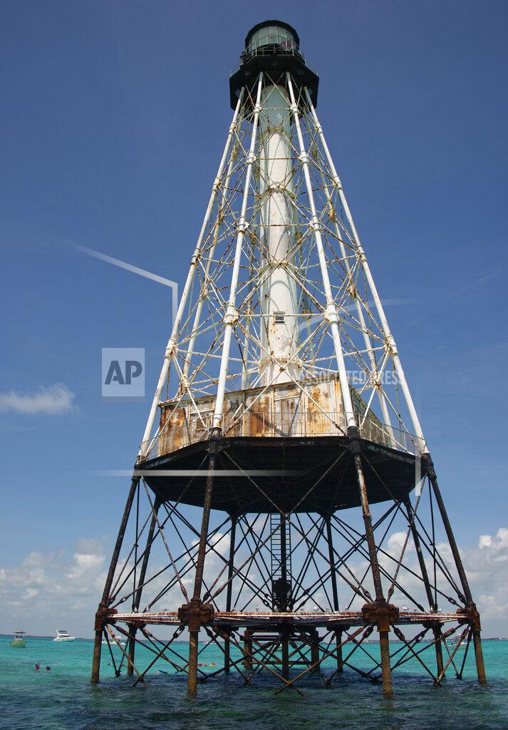 Andy Newman This photo provided by the Florida Keys News Bureau shows Alligator Reef Lighthouse, Tuesday, Sept. 7, 2021, off Islamorada, Fla., in the Florida Keys. On Tuesday, officials from the Islamorada-based Friends of the Pool, Inc., announced that U.S. Secretary of the Interior Deb Haaland approved a recommendation from the National Park Service that the organization be granted ownership of the lighthouse under the National Historic Lighthouse Preservation Act. Friends of the Pool hopes to raise about $9 million to preserve the almost 150-year-old structure. (Andy Newman/Florida Keys News Bureau via AP)