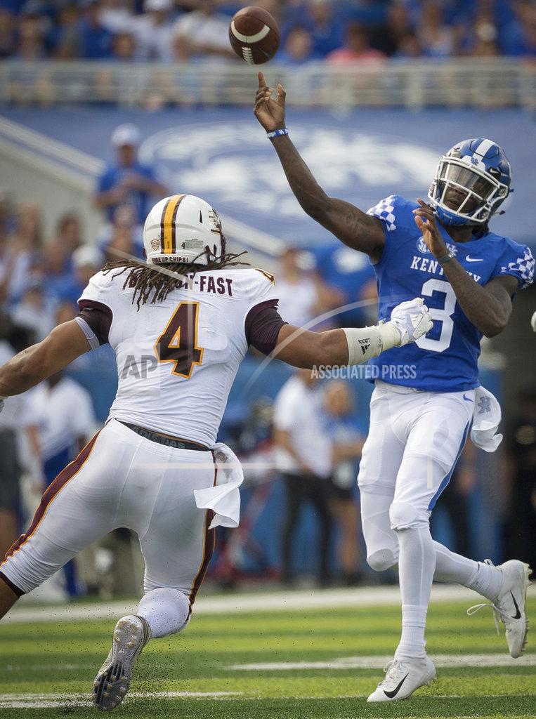 Bryan Woolston Kentucky quarterback Terry Wilson (3) passes the ball over Central Michigan defensive lineman Nate Brisson-Fast during the first half of an NCAA college football game in Lexington, Ky., Saturday, Sept. 1, 2018. (AP Photo/Bryan Woolston)
