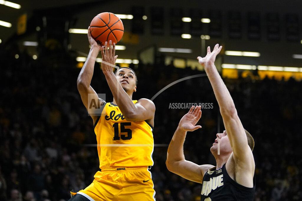 Charlie Neibergall Iowa forward Keegan Murray (15) shoots over Purdue forward Caleb Furst during the second half of an NCAA college basketball game, Thursday, Jan. 27, 2022, in Iowa City, Iowa. (AP Photo/Charlie Neibergall)
