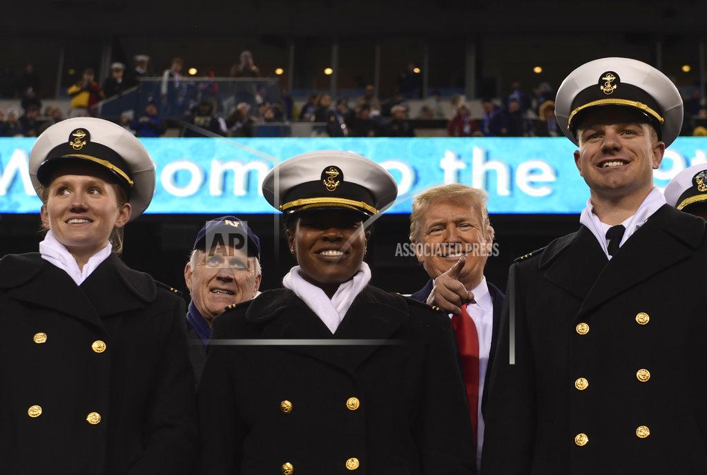 Susan Walsh President Donald Trump, standing with Navy Secretary Richard Spencer, second from left, watches the second half of the Army-Navy football game in Philadelphia, Saturday, Dec. 8, 2018. (AP Photo/Susan Walsh)