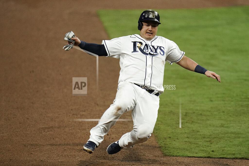 Gregory Bull FILE - In this Oct. 17, 2020, file photo, Tampa Bay Rays' Ji-Man Choi advances to third on a sacrifice fly by Joey Wendle during the sixth inning in Game 7 of the baseball American League Championship Series against the Houston Astros in San Diego. Choi and the Rays argued their salary arbitration case Thursday, Feb. 4. The 29-year-old asked for a raise to $2.45 million, and the Rays argued for $1.85 million. A decision is expected Friday from Margaret Brogan, Gary Kendellen and Brian Keller, who heard the case over Zoom. (AP Photo/Gregory Bull, File)