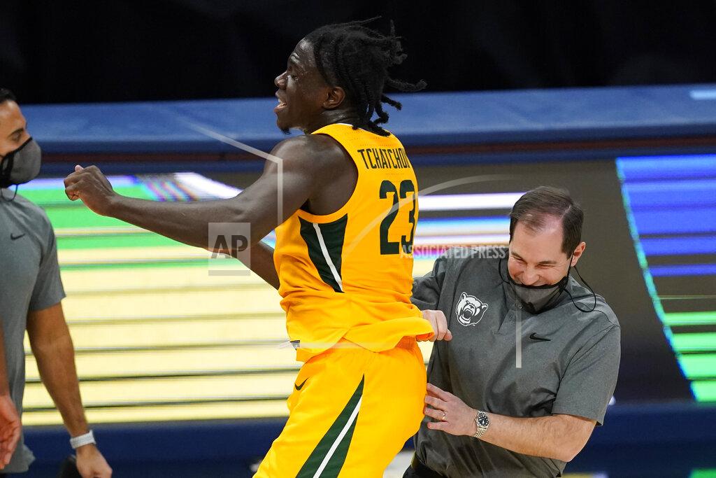 Darron Cummings Baylor coach Scott Drew celebrates with Jonathan Tchamwa Tchatchoua following the team's NCAA college basketball game against Illinois, early Thursday, Dec. 3, 2020, in Indianapolis. Baylor won 82-69. (AP Photo/Darron Cummings)
