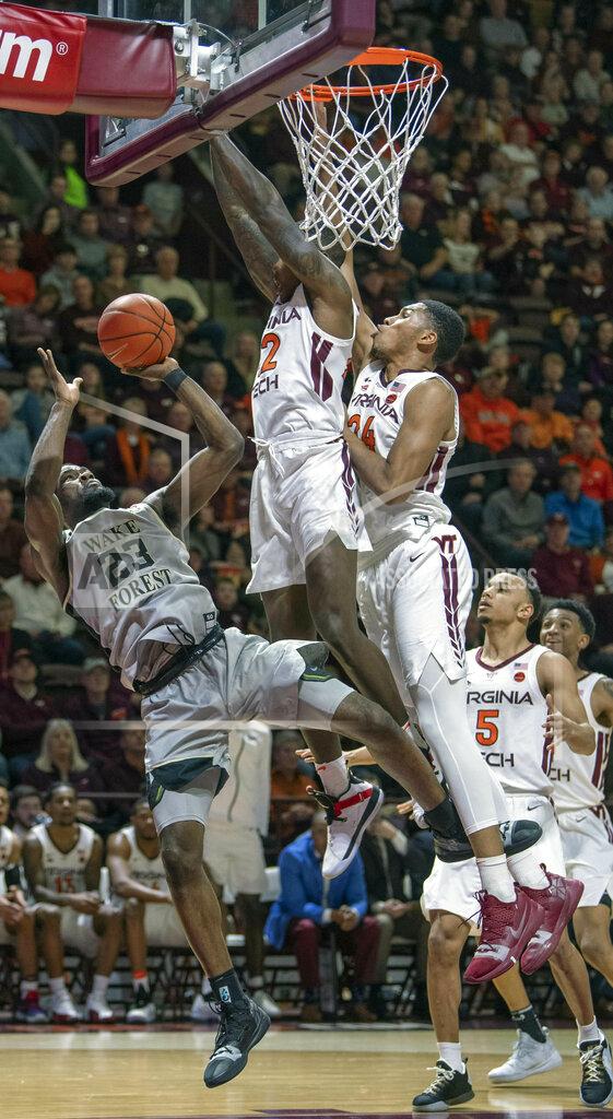 Don Petersen Wake Forest guard Chaundee Brown (23) shoots the ball against Virginia Tech guard Ty Outlaw (42) and Virginia Tech forward Kerry Blackshear Jr. (24) during the first half of an NCAA college basketball game Saturday, Jan. 19, 2019, in Blacksburg, Va. (AP Photo/Don Petersen)