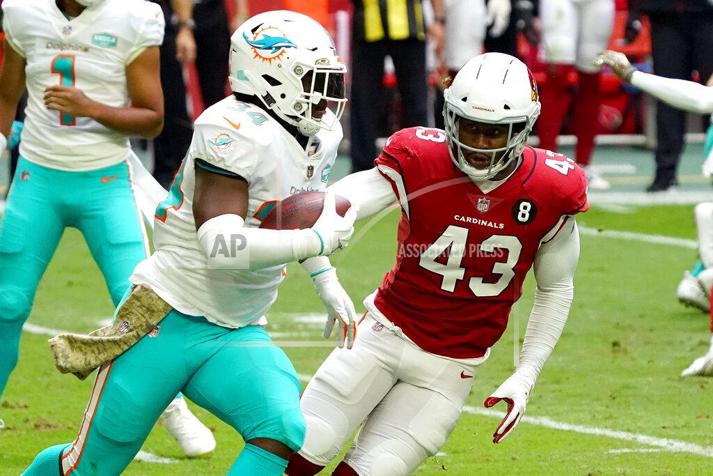 Rick Scuteri Miami Dolphins running back Jordan Howard (34) runs the ball as Arizona Cardinals outside linebacker Haason Reddick (43) defends during the first half of an NFL football game, Sunday, Nov. 8, 2020, in Glendale, Ariz. (AP Photo/Rick Scuteri)