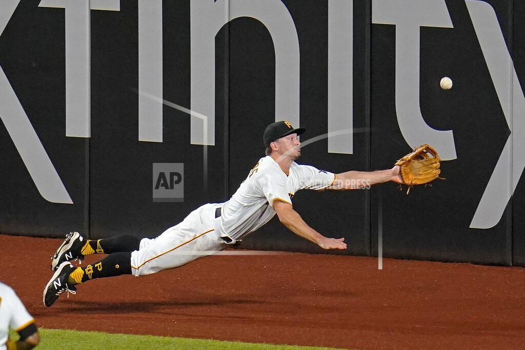 Gene J. Puskar Pittsburgh Pirates left fielder Bryan Reynolds dives for but can't come up with a fly ball hit by Los Angeles Dodgers' Mookie Betts for an RBI triple during the fifth inning of a baseball game in Pittsburgh, Tuesday, June 8, 2021. (AP Photo/Gene J. Puskar)