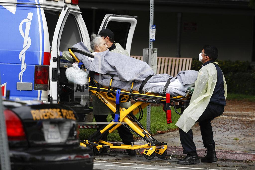 Chris Carlson FILE - This April 8, 2020, file photo shows a patient being evacuated from the Magnolia Rehabilitation and Nursing Center in Riverside, Calif. After months spent tamping down surges and keeping the coronavirus at manageable levels, a variety of factors combined to bring California to a crisis point in the pandemic. (AP Photo/Chris Carlson, File)