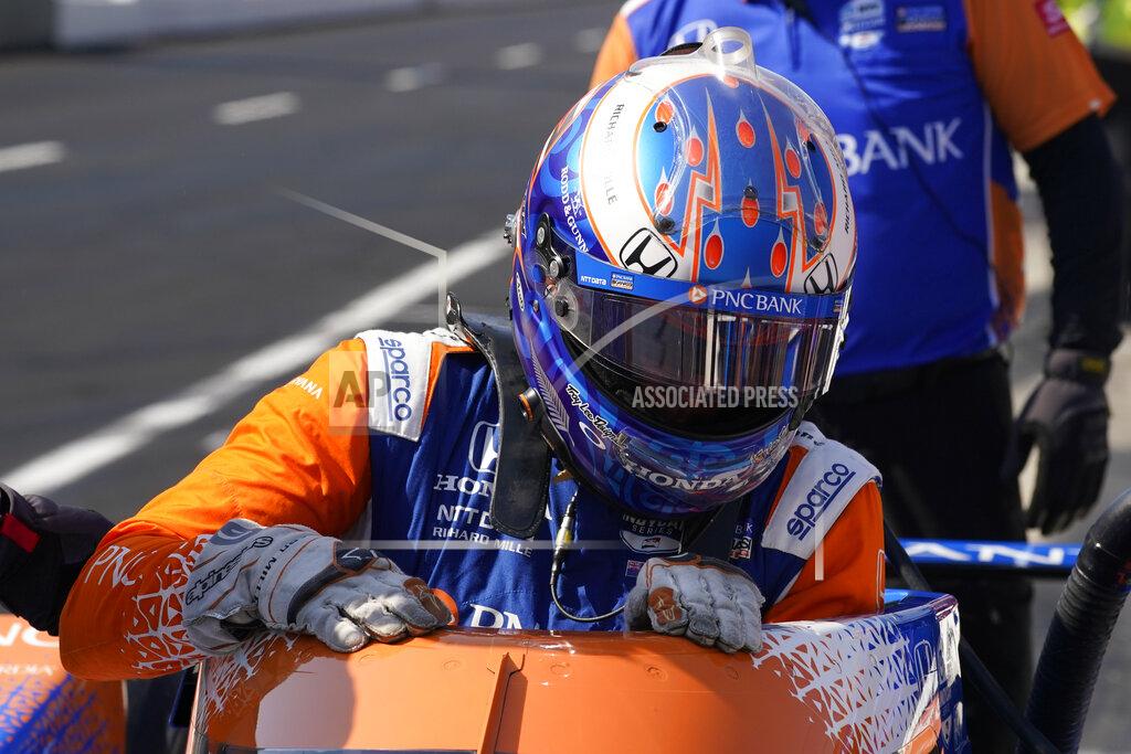 Scott Dixon, of New Zealand, climbs out od his car during practice for the Indianapolis 500 auto race at Indianapolis Motor Speedway, Friday, May 20, 2022, in Indianapolis. (AP Photo/Darron Cummings)