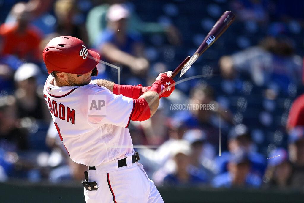 Nick Wass Washington Nationals' Carter Kieboom hits a broken bat single during the fourth inning of the first baseball game of a doubleheader against the New York Mets, Saturday, Sept. 4, 2021, in Washington. The Mets won 11-9 in extra innings. (AP Photo/Nick Wass)