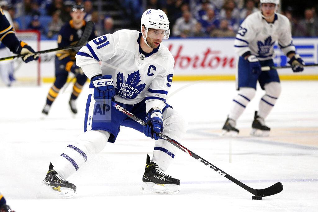 Jeffrey T. Barnes FILE - In this Feb. 16, 2020, file photo, Toronto Maple Leafs forward John Tavares (91) carries the puck during the first period of an NHL hockey game against the Buffalo Sabres in Buffalo, N.Y. Among the unknowns about the NHL returning amid the coronavirus pandemic is what the on-ice product might look like. (AP Photo/Jeffrey T. Barnes, File)