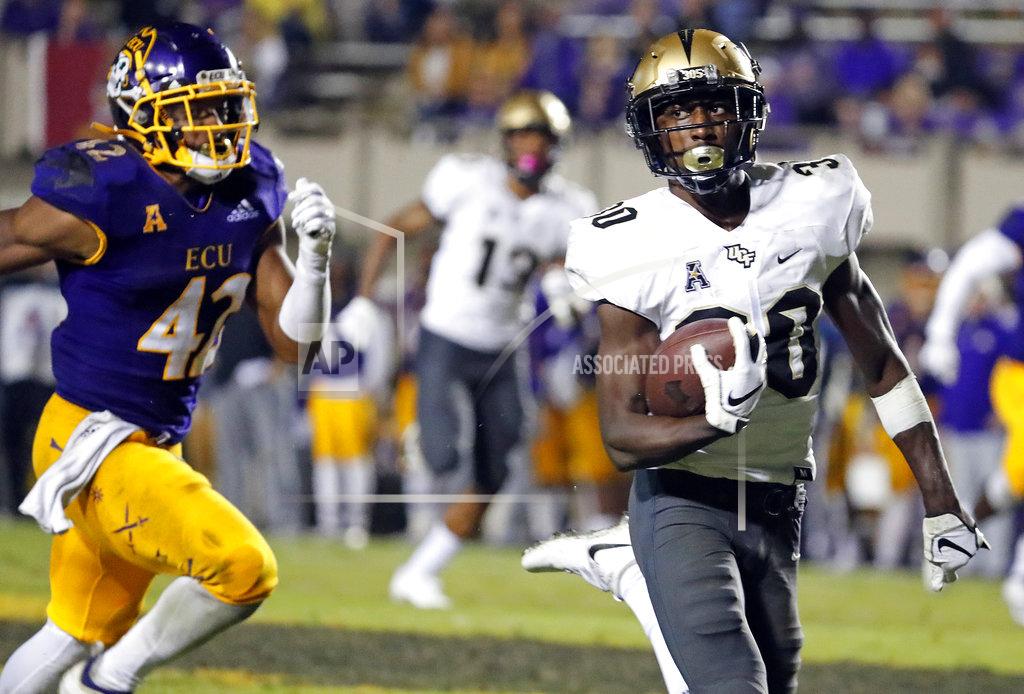 Karl B Deblaker Central Florida's Alex Swenson (30) runs away from East Carolina's Devon Sutton (42) during the second half of an NCAA college football game in Greenville, N.C., Saturday, Oct. 20, 2018. UCF won 37-10. (AP Photo/Karl B DeBlaker)