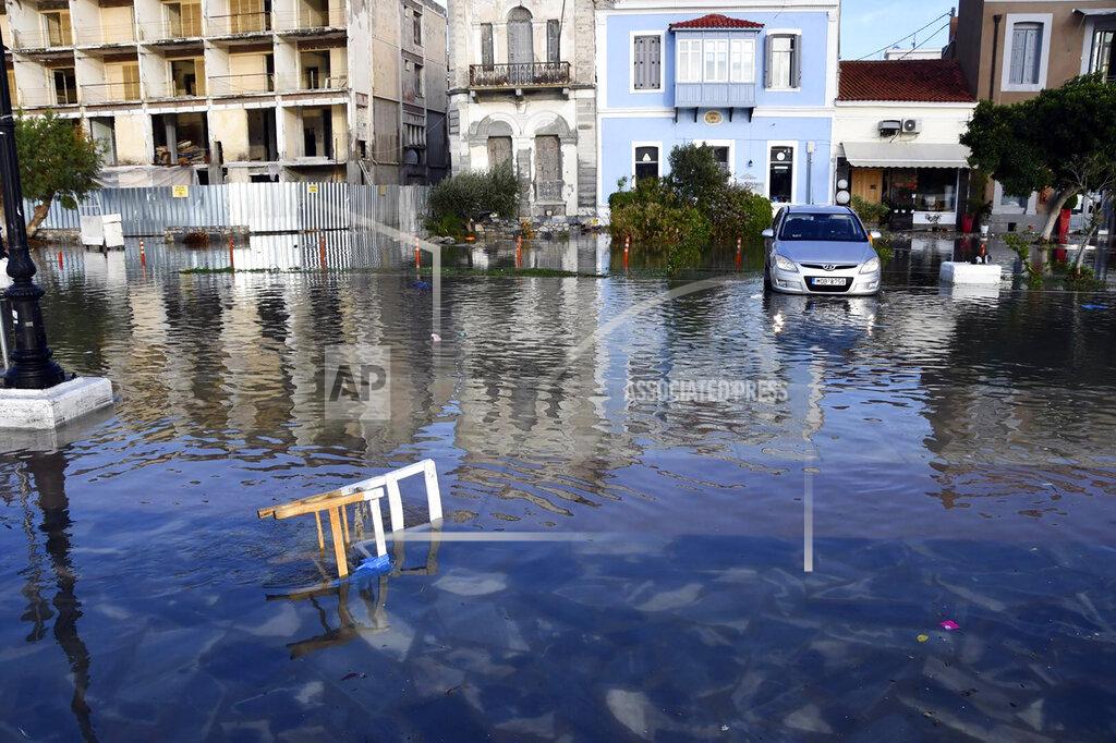 Michael Svarnias Seawater covers a road after an earthquake at the port of Vathi on the eastern Aegean island of Samos, Greece, Friday, Oct. 30, 2020. A strong earthquake struck in the Aegean Sea between the Turkish coast and the Greek island of Samos as the magnitude 6.6 earthquake was centered in the Aegean at a depth of 16.5 kilometers, or 10.3 miles.(AP Photo/Michael Svarnias)
