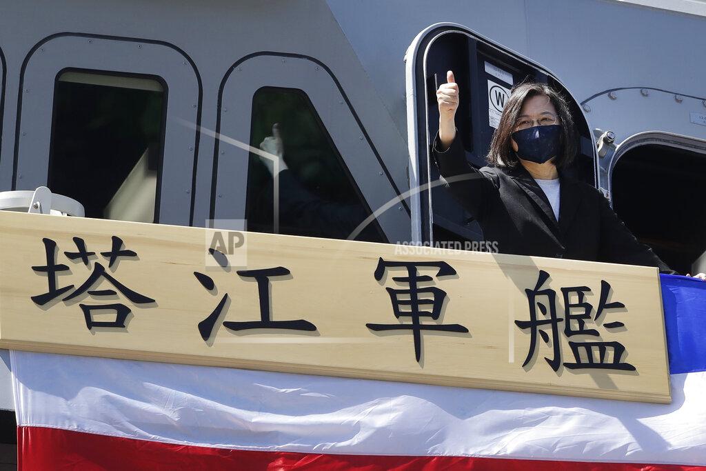 Chiang Ying-Ying Taiwan's President Tsai Ing-wen gives a "thumbs up" on the domestically made Tajiang warship during its commissioning ceremony at the Suao naval base in Yilan county, Taiwan, Thursday, Sept. 9, 2021. Taiwan's president oversaw the commissioning of a new domestically made navy warship Thursday as part of the island's plan to boost indigenous defense capacity amid heightened tensions with China. Chinese characters read "Ta Jiang Warship." (AP Photo/Chiang Ying-ying)