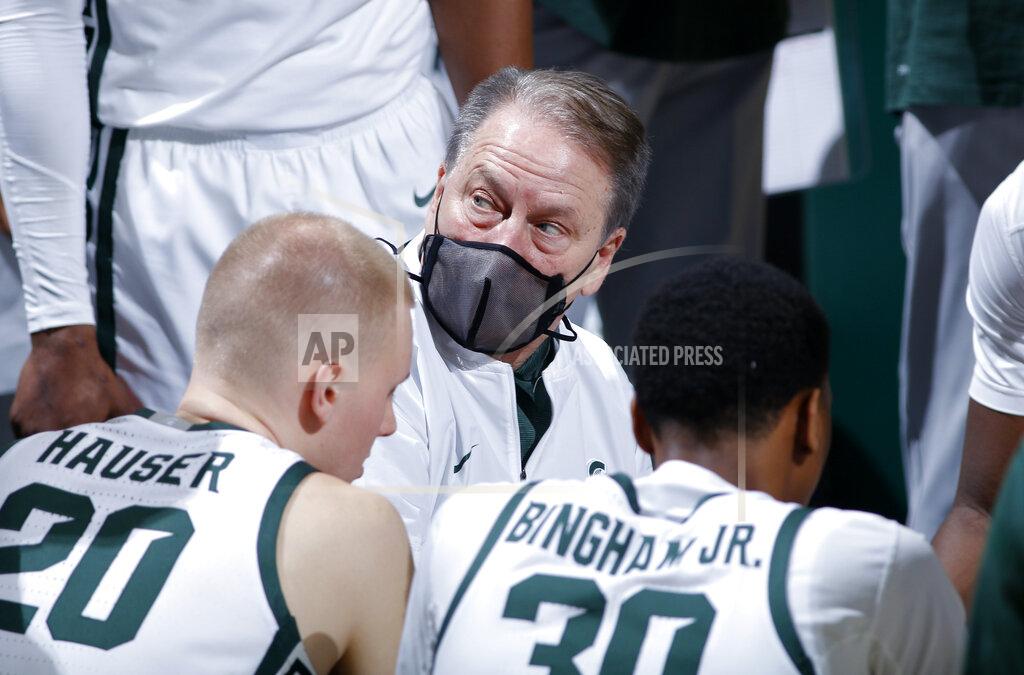 Al Goldis Michigan State coach Tom Izzo, center, talks to players during a timeout in the second half of an NCAA college basketball game against Indiana, Tuesday, March 2, 2021, in East Lansing, Mich. Michigan State won 64-58. (AP Photo/Al Goldis)