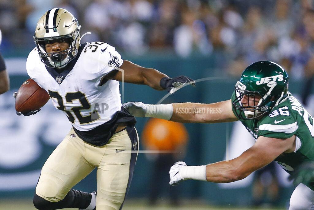 Adam Hunger New Orleans Saints' Jacquizz Rodgers (32) stiff-arms New York Jets' Henry Anderson (96) during the first half of a preseason NFL football game Saturday, Aug. 24, 2019, in East Rutherford, N.J. (AP Photo/Adam Hunger)