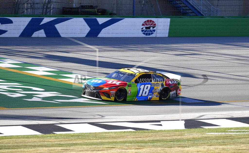 Timothy D. Easley Kyle Busch crosses the line during qualifying for a NASCAR Series auto race at Kentucky Speedway in Sparta, Ky., Friday, July 12, 2019. (AP Photo/Timothy D. Easley)