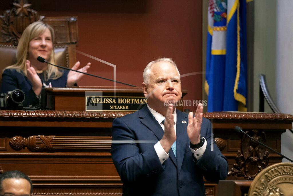 Glen Stubbe Gov. Tim Walz applauds while delivering his State of the State address in the Minnesota House of Representative Chambers in front of senators and representatives, Sunday, April 24, 2022, in St. Paul, Minn. (Glen Stubbe/Star Tribune via AP)